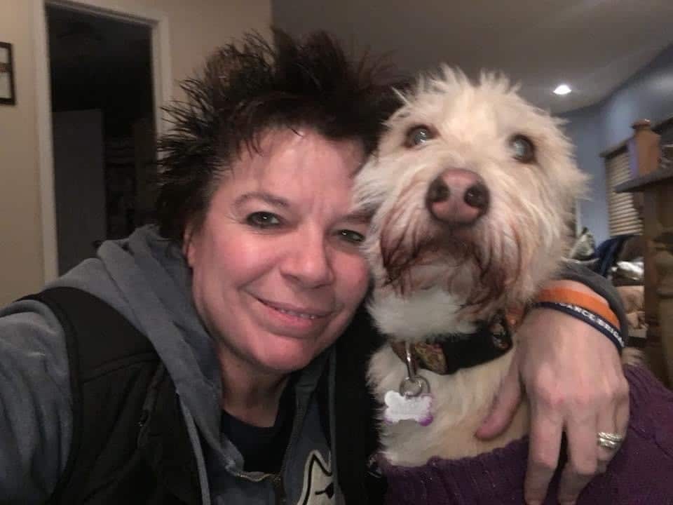 woman taking selfie with dog